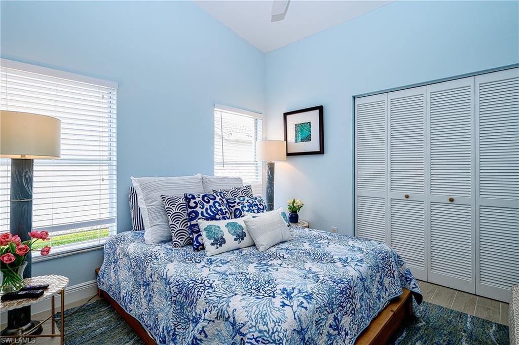 7311 Mill Pond Circle Naples, FL 34109 - Photo 26 of 42 a bedroom with bed and a window
