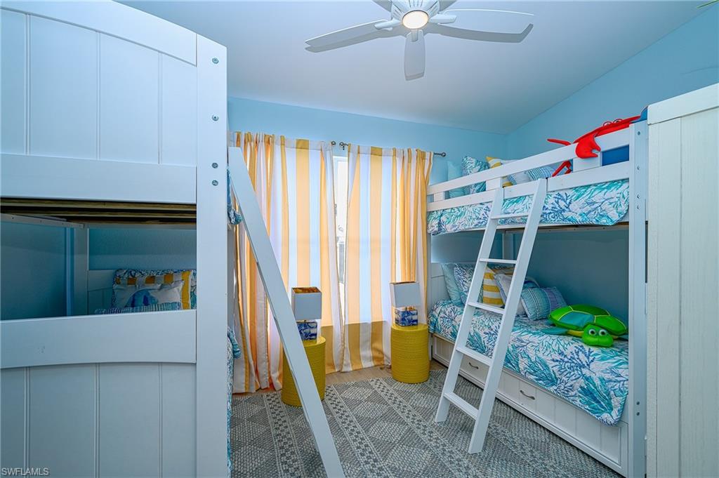 7311 Mill Pond Circle Naples, FL 34109 - Photo 28 of 42 a bed room with a bed and a window