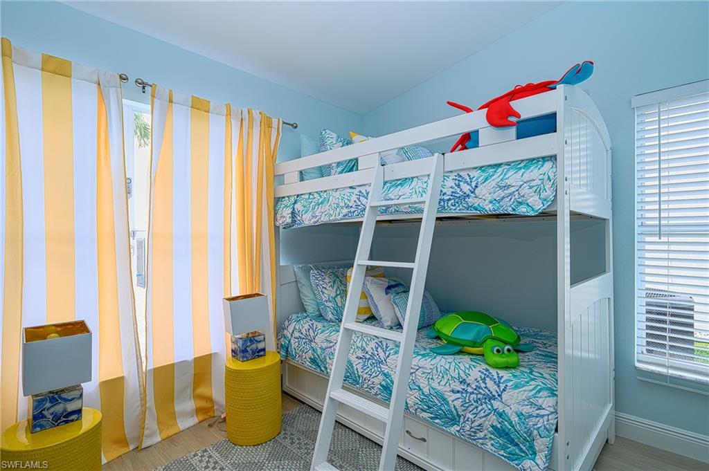 7311 Mill Pond Circle Naples, FL 34109 - Photo 29 of 42 a front view of a house with outdoor space