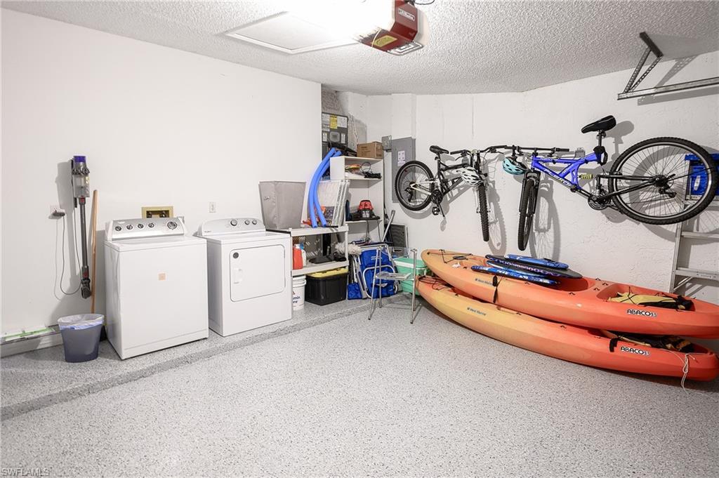 7311 Mill Pond Circle Naples, FL 34109 - Photo 30 of 42 a storage room with washer and dryer