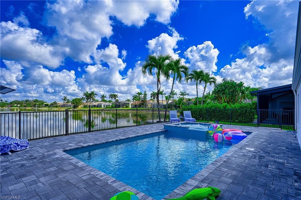 7311 Mill Pond Circle Naples, FL 34109 - Photo 3 of 42 a park view with a swimming pool