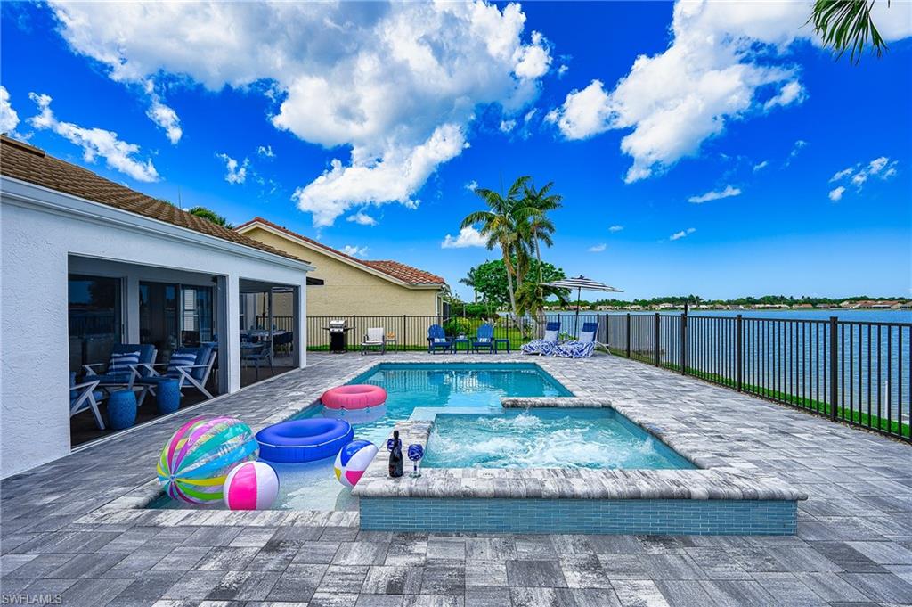 7311 Mill Pond Circle Naples, FL 34109 - Photo 35 of 42 a view of yard with swimming pool and furniture