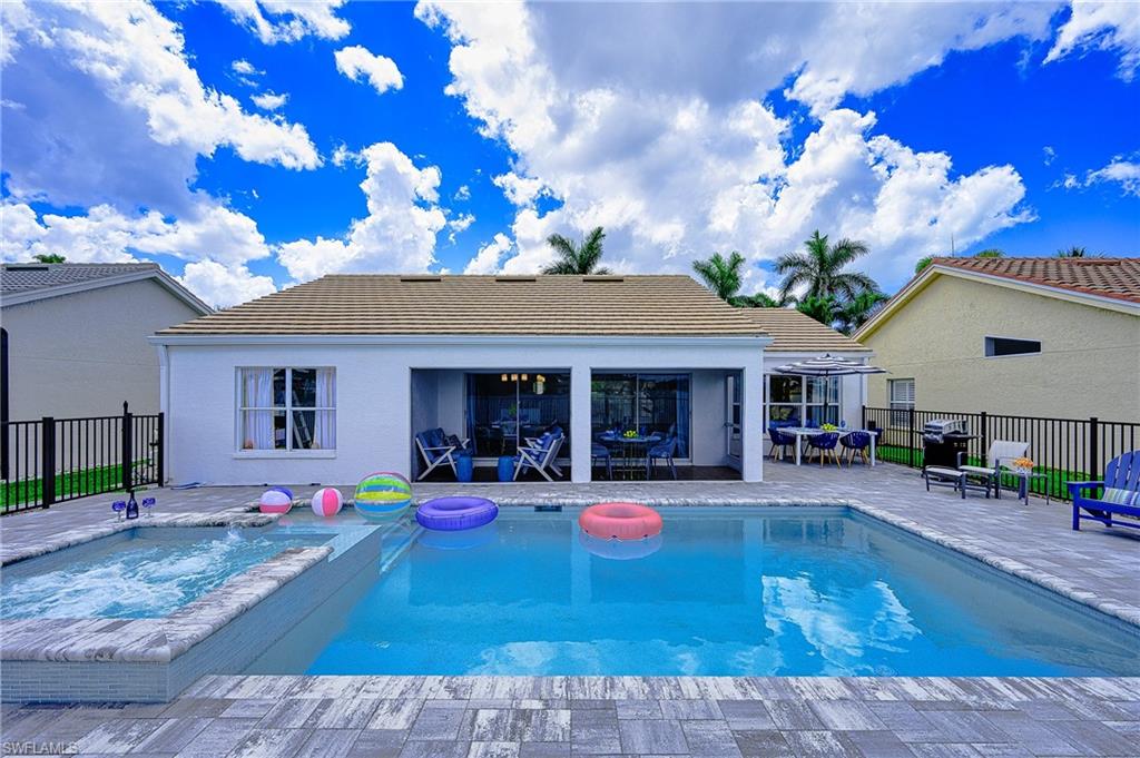 7311 Mill Pond Circle Naples, FL 34109 - Photo 37 of 42 a view of a house with swimming pool