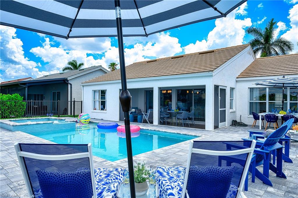 7311 Mill Pond Circle Naples, FL 34109 - Photo 38 of 42 a house view with a sitting space and garden space