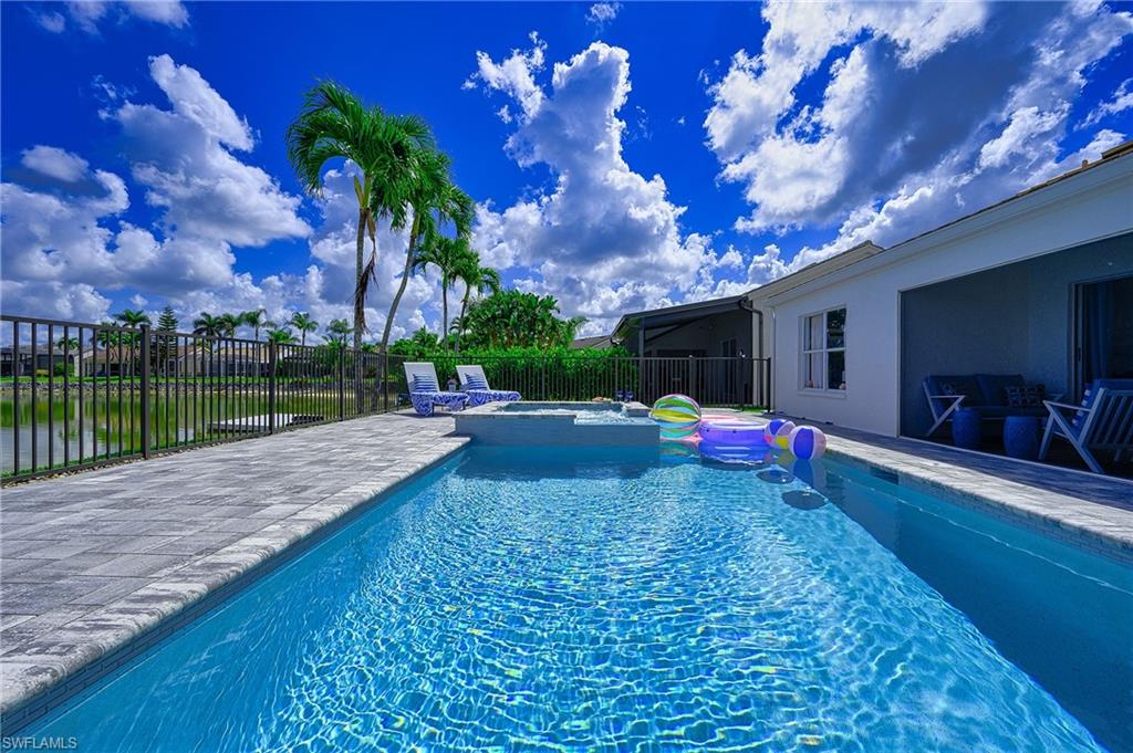 7311 Mill Pond Circle Naples, FL 34109 - Photo 6 of 42 a view of a backyard with a garden and entertaining space