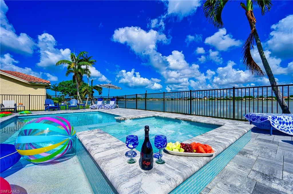 7311 Mill Pond Circle Naples, FL 34109 - Photo 8 of 42 a view of a chairs in patio with a fire pit