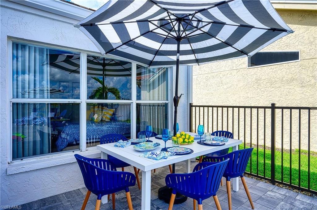7311 Mill Pond Circle Naples, FL 34109 - Photo 9 of 42 a view of a dining room with furniture window and outside view