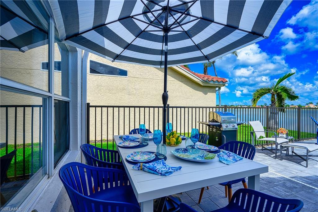 7311 Mill Pond Circle Naples, FL 34109 - Photo 10 of 42 a view of a patio with furniture