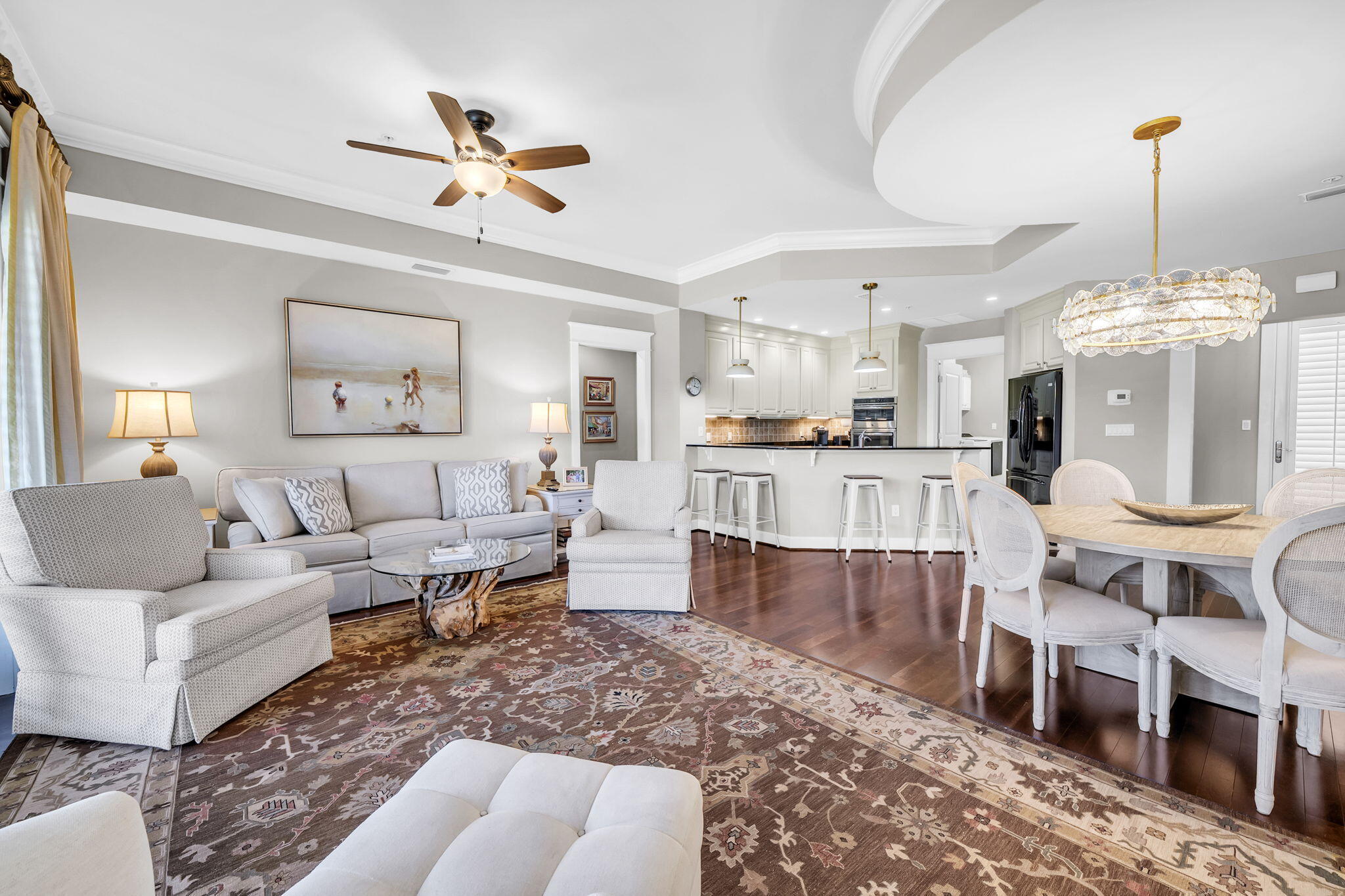 5360 Pine Ridge Lane, Unit 5360 Miramar Beach, FL 32550 - Photo 6 of 44 a living room with furniture a dining table and a chandelier