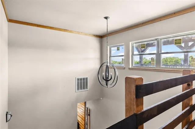 a spacious bathroom with a sink a toilet a large mirror and shower