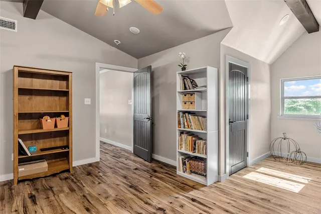 a view of a room with gym equipment and a window