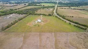 a picture of a bench in front of a wall