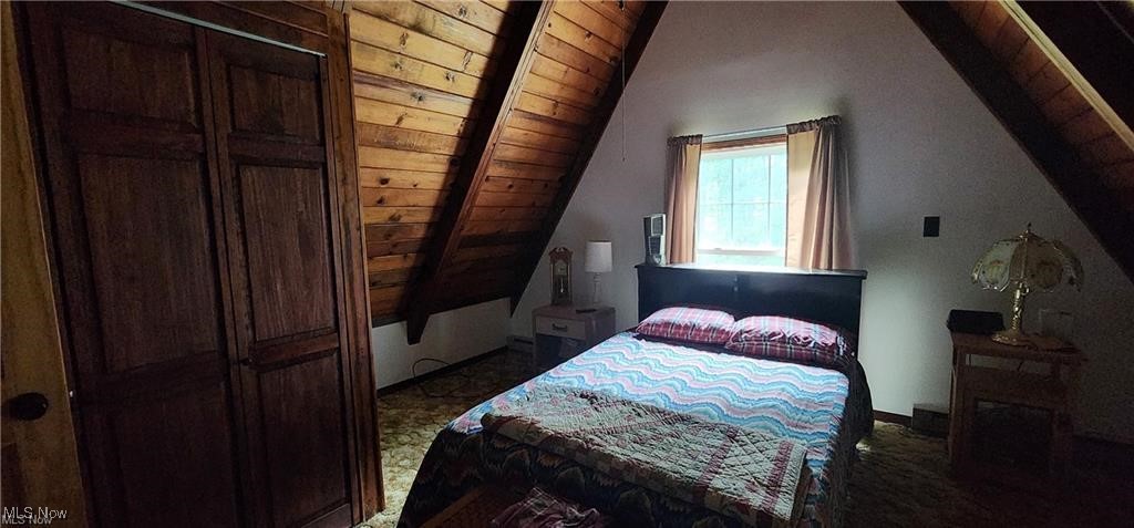 6699 Howard Road Williamsfield, OH 44093 - Photo 18 of 31 Carpeted bedroom with vaulted ceiling and wood ceiling