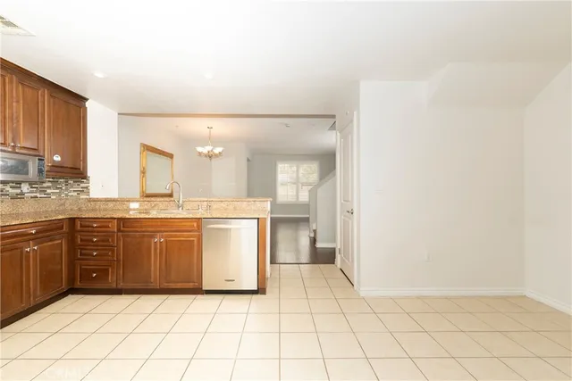 a large bathroom with a granite countertop sink and a mirror