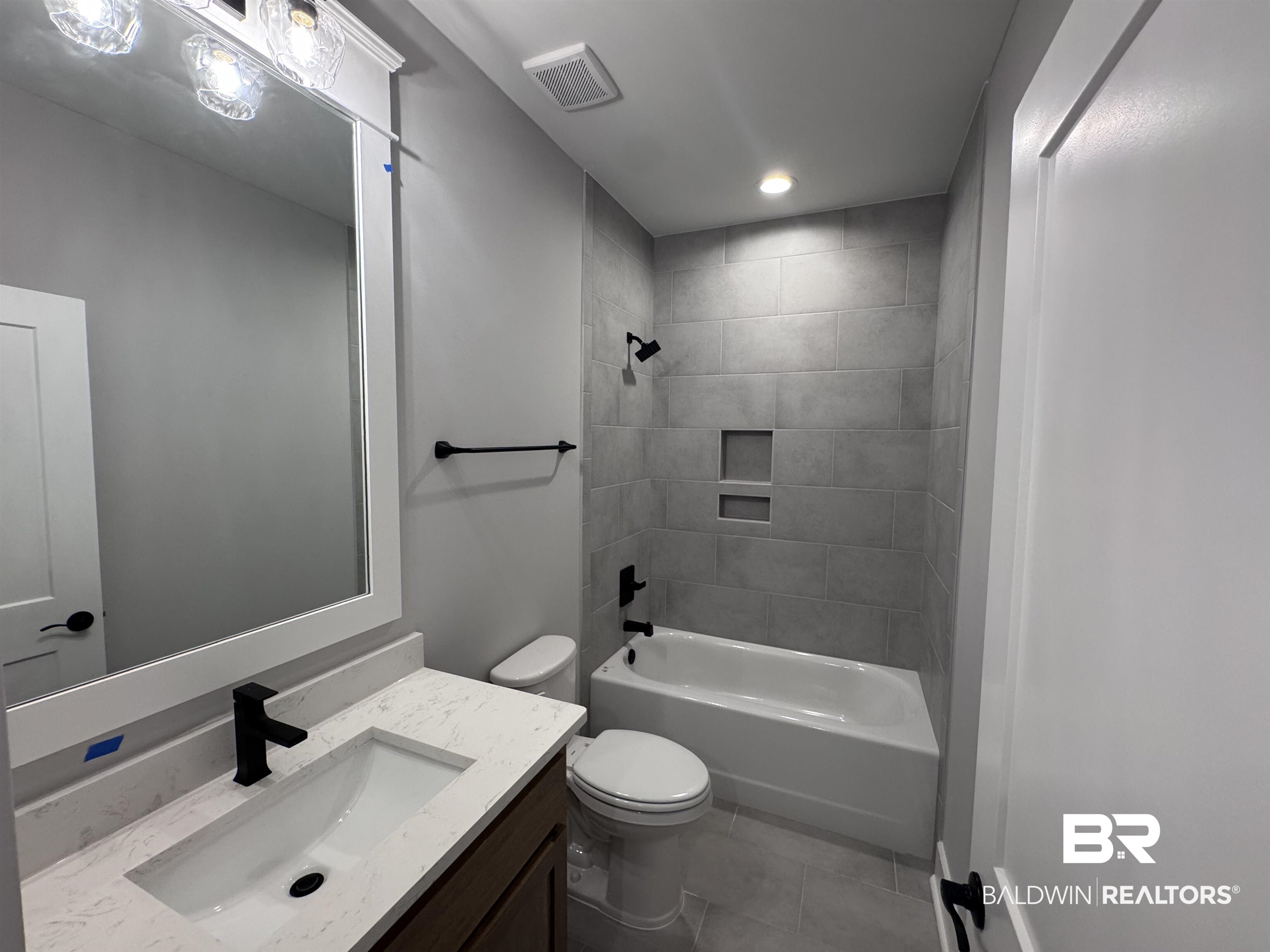 27371 Patch Pl Loop Daphne, AL 36526 - Photo 47 of 63 Bathroom featuring vanity, bathtub / shower combination, light tile patterned flooring, and recessed lighting
