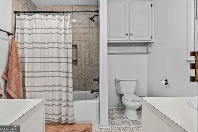 a view of a livingroom with a fireplace and a large window