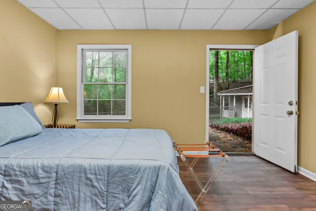 a view of a patio with table and chairs and potted plants