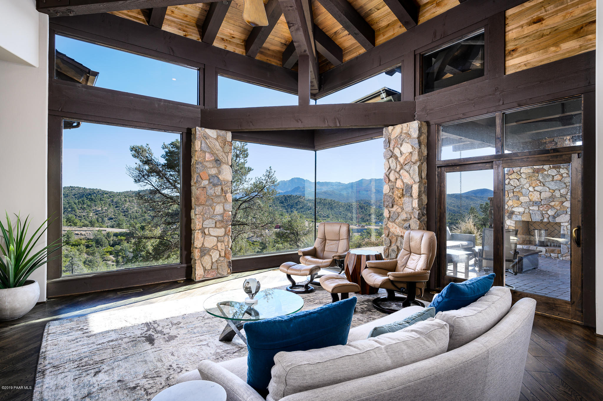 6785 West Almosta Ranch Road Prescott, AZ 86305 - Photo 13 of 81 a living room with furniture and a floor to ceiling window