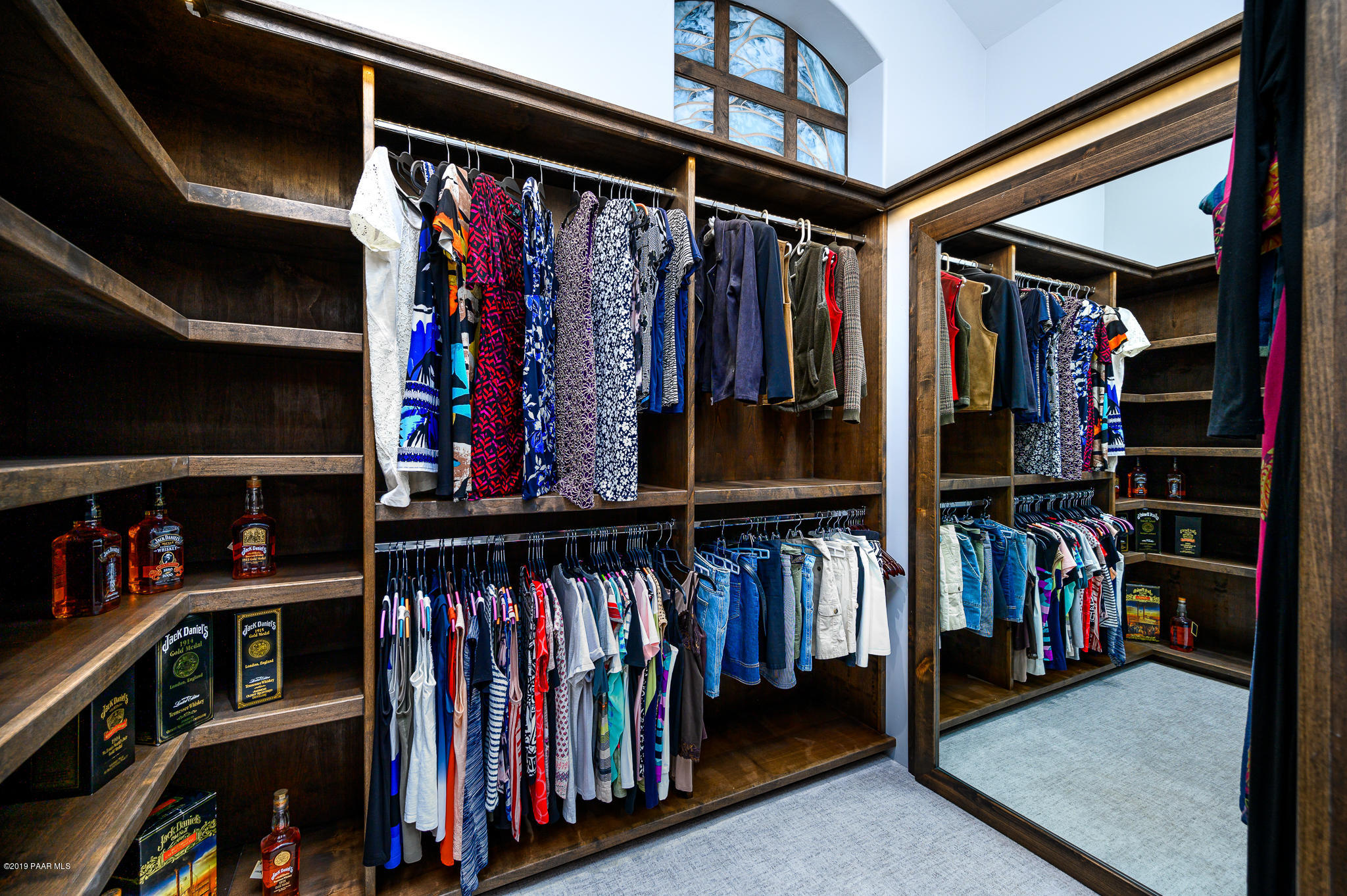 6785 West Almosta Ranch Road Prescott, AZ 86305 - Photo 35 of 81 a view of walk in closet with clothes and shoes