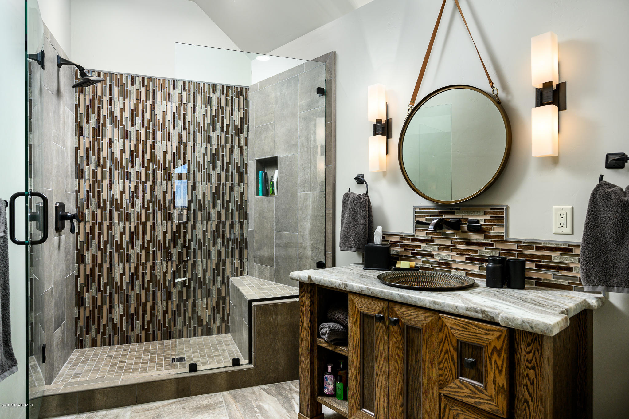 6785 West Almosta Ranch Road Prescott, AZ 86305 - Photo 46 of 81 a bathroom with a granite countertop sink a mirror and shower