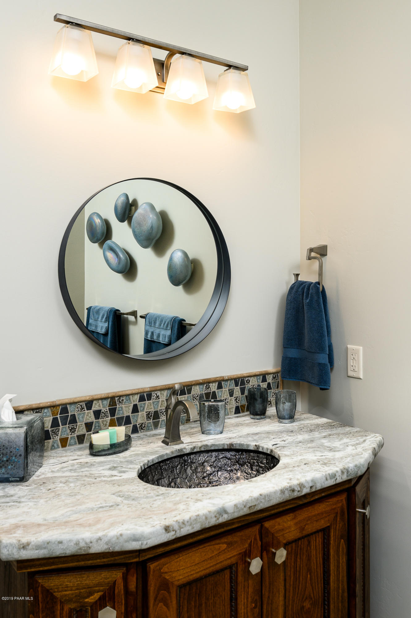6785 West Almosta Ranch Road Prescott, AZ 86305 - Photo 53 of 81 a bathroom with a granite countertop sink and mirror