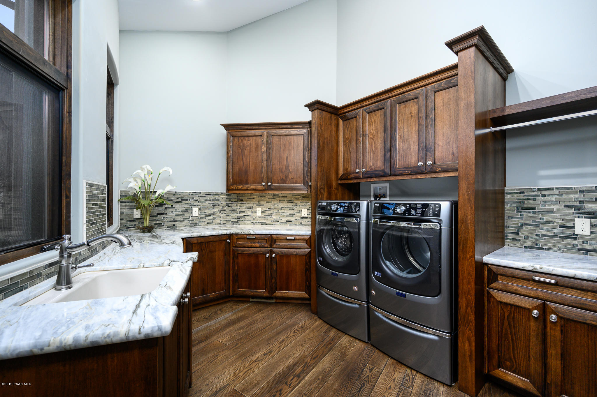 6785 West Almosta Ranch Road Prescott, AZ 86305 - Photo 54 of 81 a kitchen with kitchen island granite countertop a stove sink and cabinets