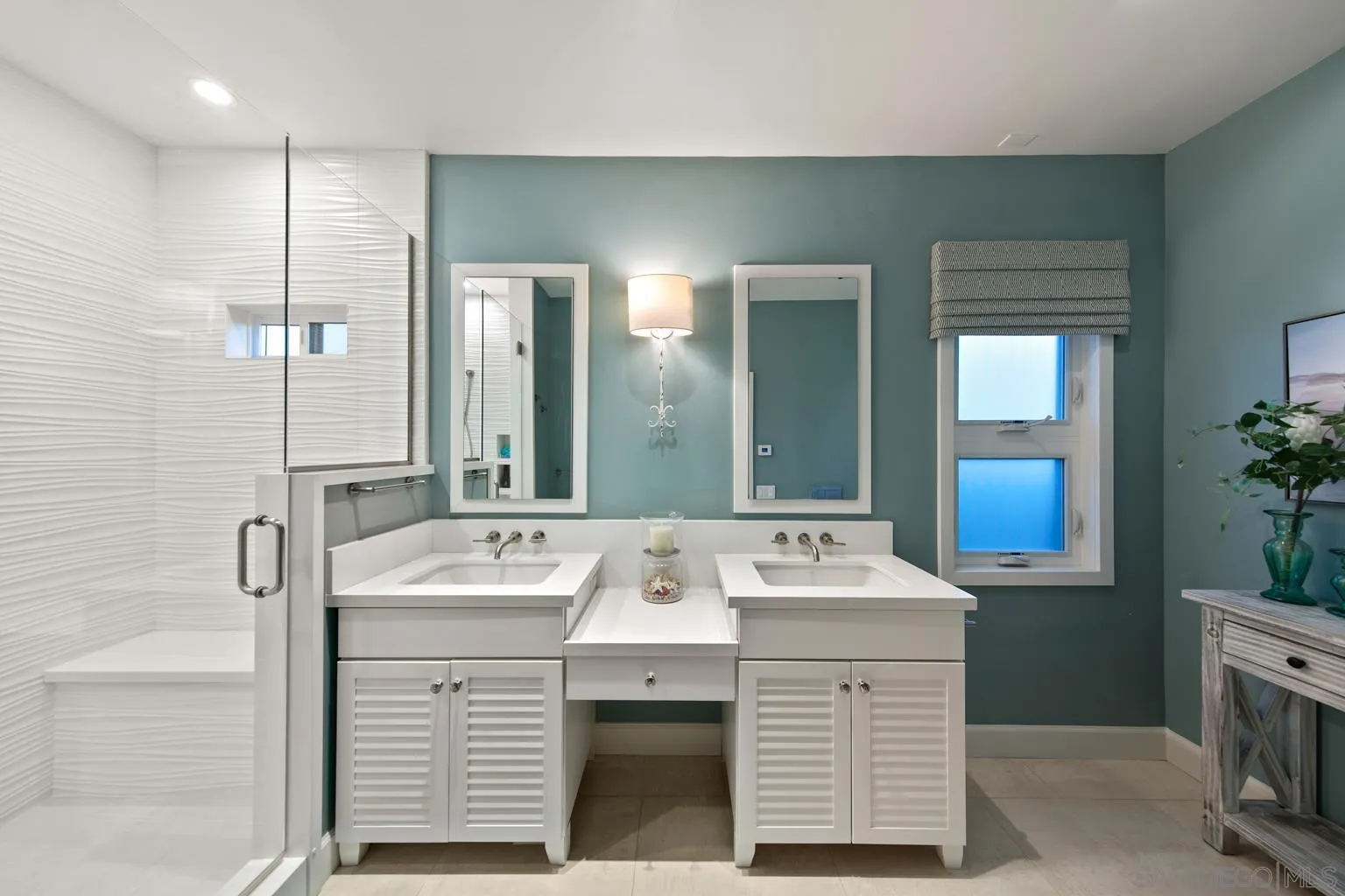 149 3rd Street Encinitas, CA 92024 - Photo 16 of 26 a bathroom with a sink double vanity and a mirror