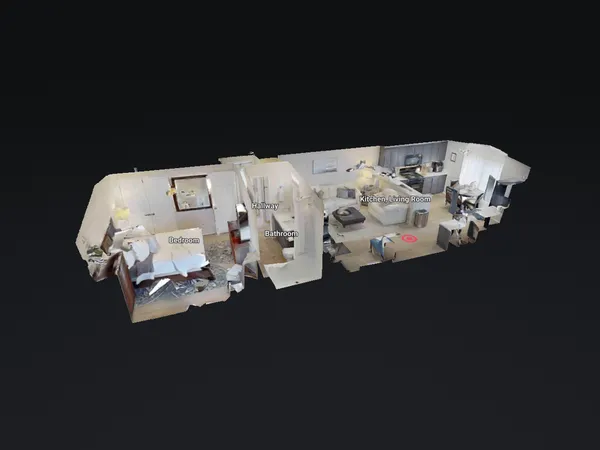 a living room with furniture and kitchen view