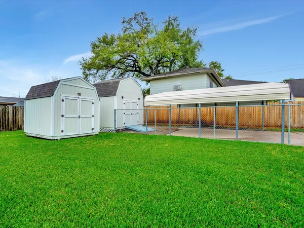 a view of a house with a back yard