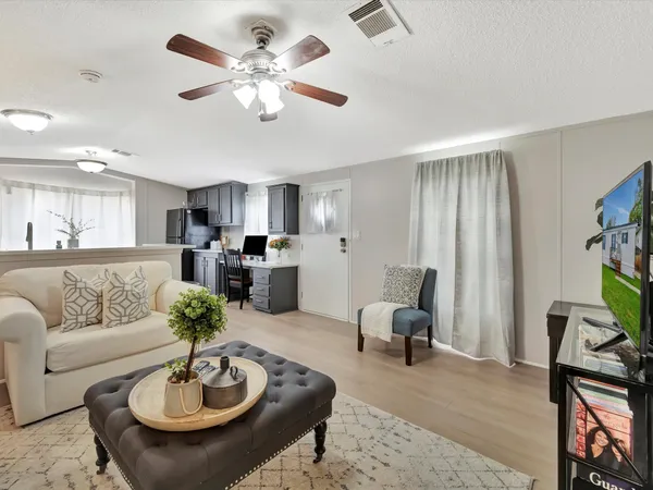 a living room with furniture and a table