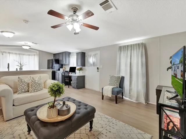 a living room with furniture and a table