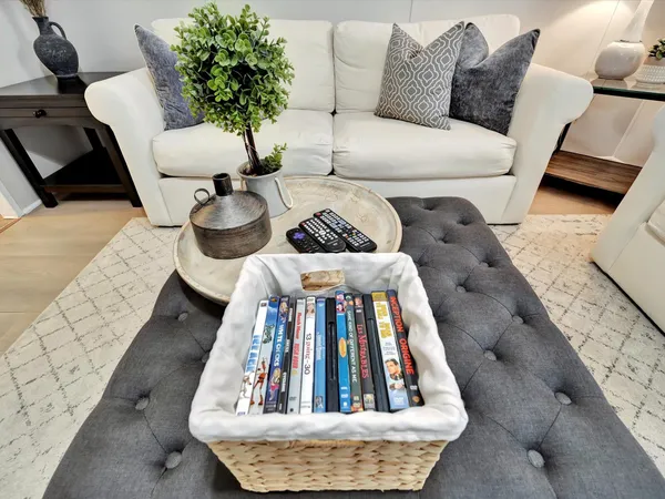 a bed sitting in a bedroom next to a couch