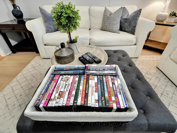a living room with furniture a dining table and kitchen view