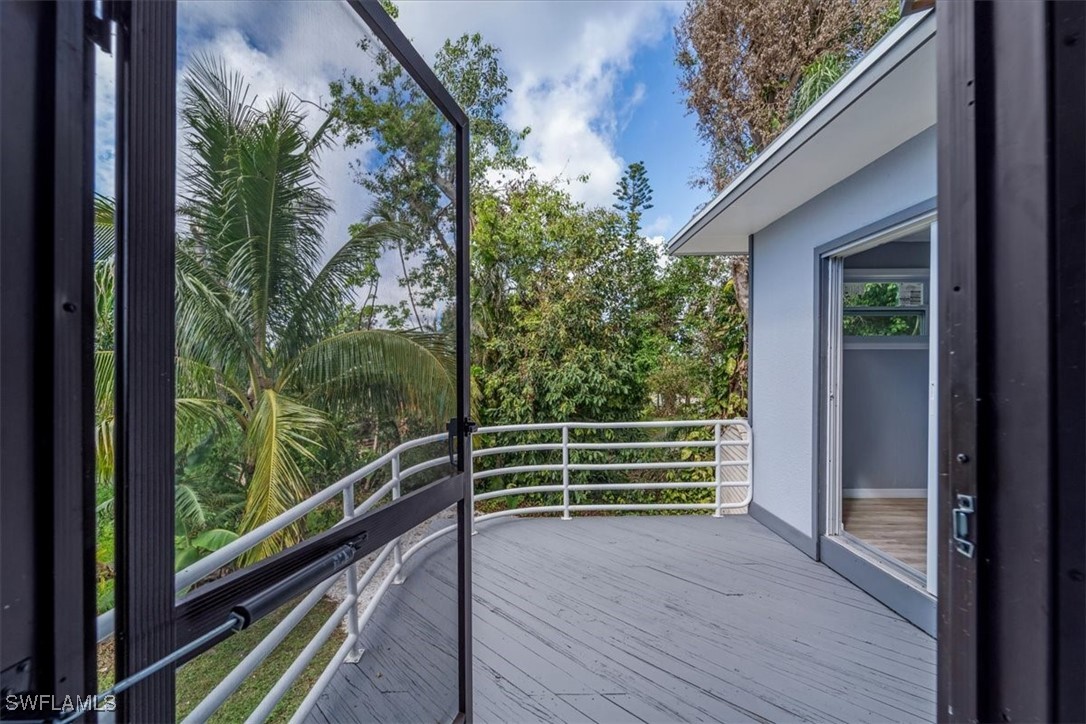 10925 Russell Road Bokeelia, FL 33922 - Photo 26 of 50 a view of outdoor space with deck and wooden floor