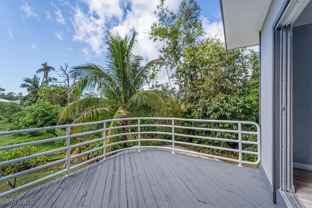 10925 Russell Road Bokeelia, FL 33922 - Photo 27 of 50 a view of a space with plants and wooden floor