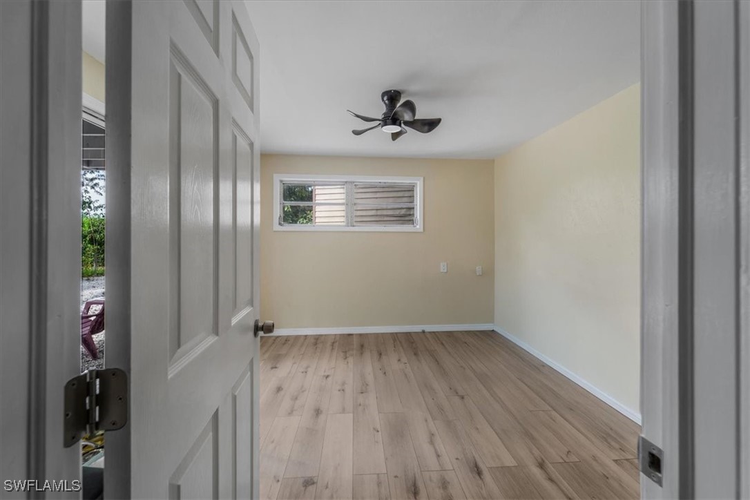 10925 Russell Road Bokeelia, FL 33922 - Photo 36 of 50 wooden floor in an empty room
