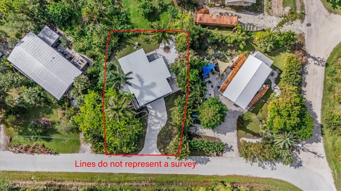 10925 Russell Road Bokeelia, FL 33922 - Photo 49 of 50 an aerial view of a house