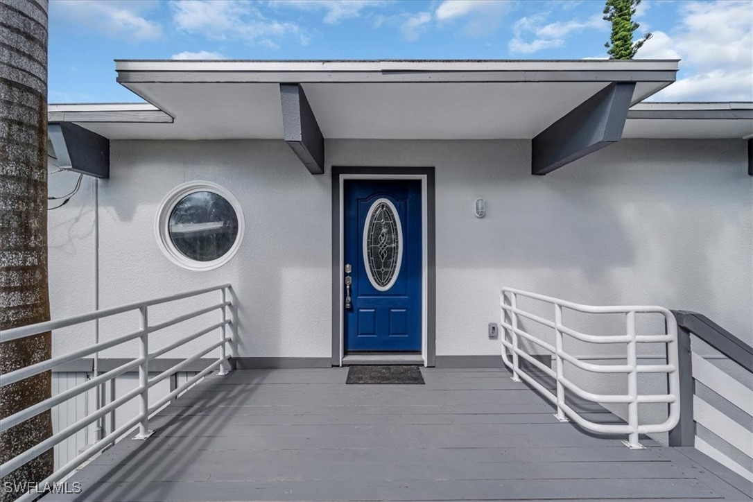 10925 Russell Road Bokeelia, FL 33922 - Photo 7 of 50 a view of empty room with furniture and a window