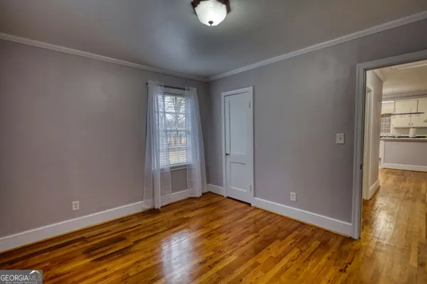 a view of a room with chair and wooden floor