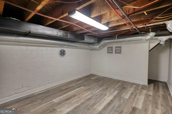 a view of a backyard with chairs and a small yard