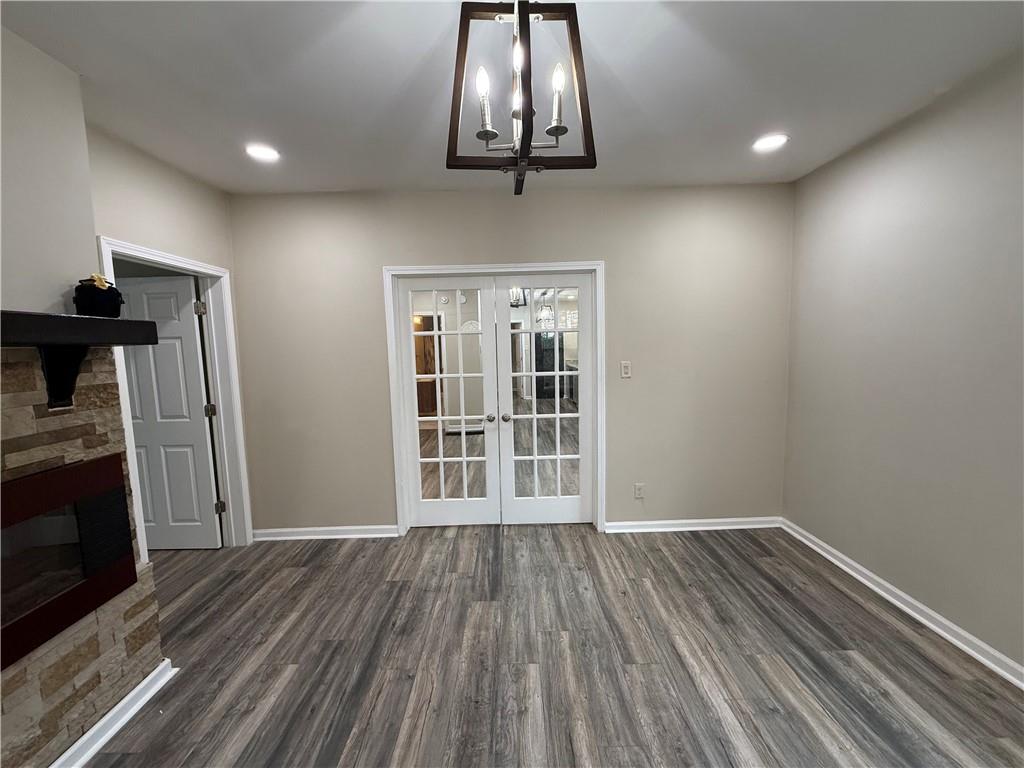 1097 Fortress Avenue Southwest Atlanta, GA 30315 - Photo 11 of 39 a view of an empty room with wooden floor and a window