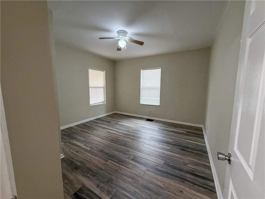 1097 Fortress Avenue Southwest Atlanta, GA 30315 - Photo 12 of 39 a view of empty room with window and wooden floor