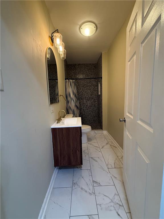 1097 Fortress Avenue Southwest Atlanta, GA 30315 - Photo 18 of 39 a bathroom with a sink a mirror and vanity