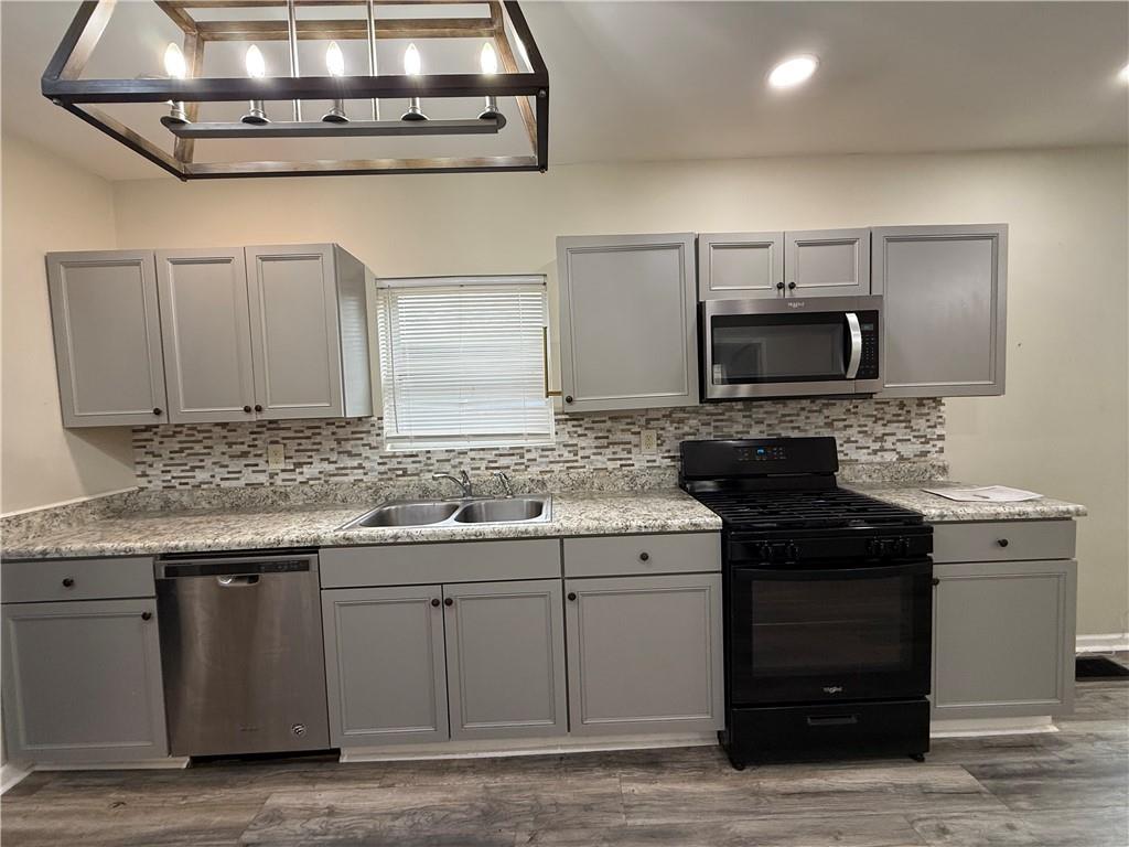 1097 Fortress Avenue Southwest Atlanta, GA 30315 - Photo 22 of 39 a kitchen with a sink and cabinets