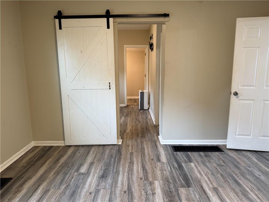 1097 Fortress Avenue Southwest Atlanta, GA 30315 - Photo 27 of 39 a view of walk in closet with wooden floor