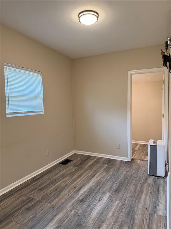1097 Fortress Avenue Southwest Atlanta, GA 30315 - Photo 28 of 39 an empty room with wooden floor and windows