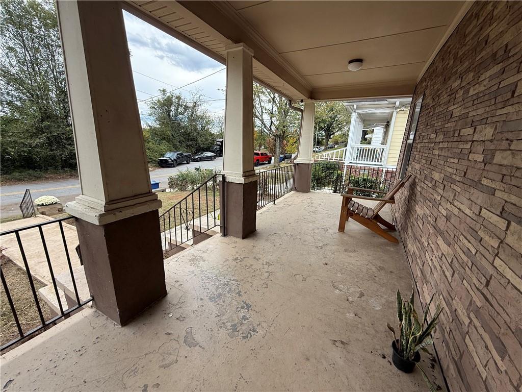 1097 Fortress Avenue Southwest Atlanta, GA 30315 - Photo 6 of 39 a view of a porch with furniture and a gate
