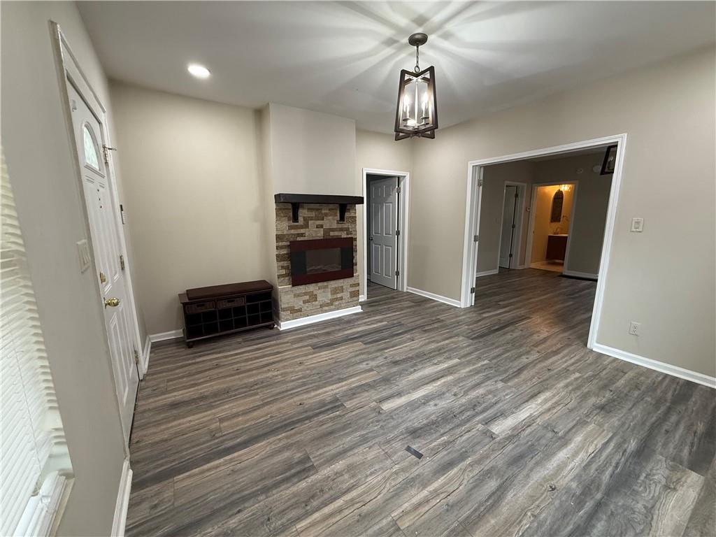 1097 Fortress Avenue Southwest Atlanta, GA 30315 - Photo 8 of 39 wooden floor in an empty room with a window