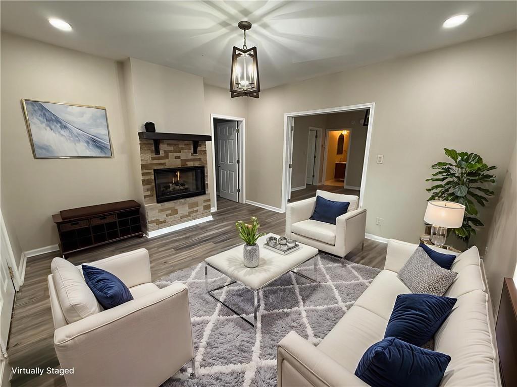 1097 Fortress Avenue Southwest Atlanta, GA 30315 - Photo 10 of 39 a living room with furniture a flat screen tv and kitchen view