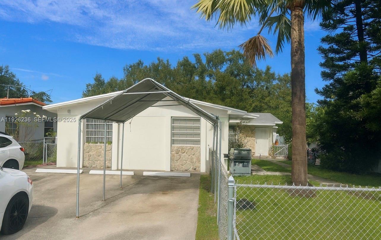 2275 Southwest 15th Street Miami, FL 33145 - Photo 2 of 10 a front view of a house with a yard